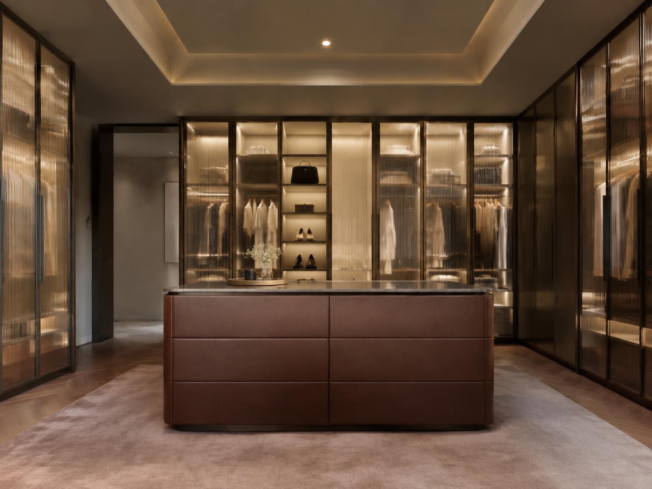 Modern luxury walk-in wardrobe with fluted glass